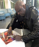 Andre Dawson signing his CBHOF fine art print by artist Robert Hurst