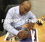 George Foreman signing fine art print by Robert Hurst
