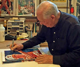 Augie Garrido - Texas autographed fine art print being signed by Garrido