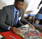 Andrea Johnson signing painting by Robert Hurst