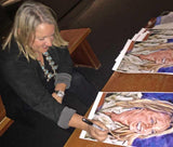 Liz Rose signing fine art print by Robert Hurst