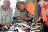 D. J. Augustin, T. J. Ford and Slater Martin signing print by Robert Hurst