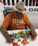 Earl Campbell signing UT Heisman Homage II fine art print by Robert Hurst