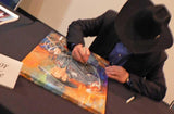 Trevor Brazile signing original painting by Robert Hurst